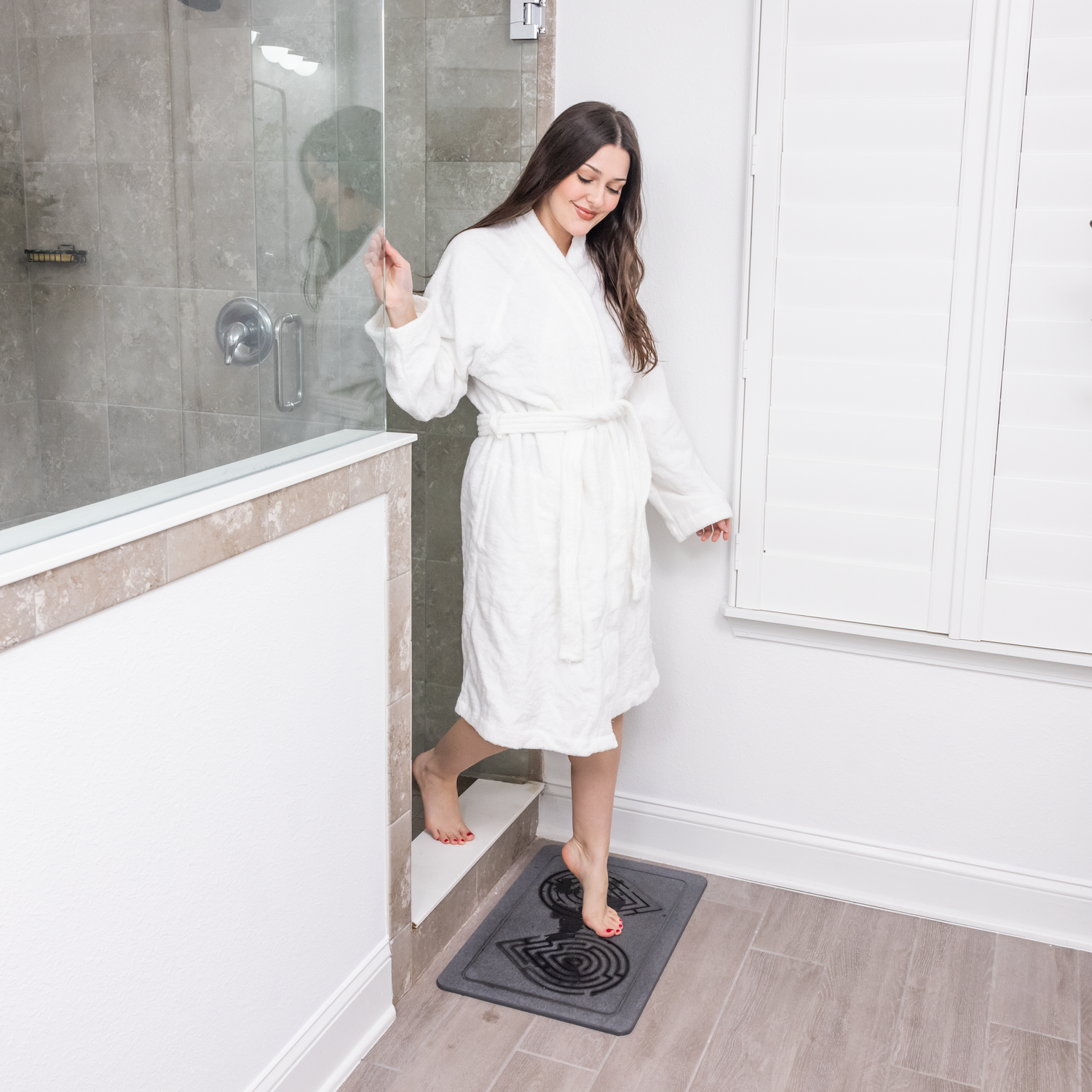 The Maze Oasis stone bath mat enhancing bathroom safety with its anti-slip surface.