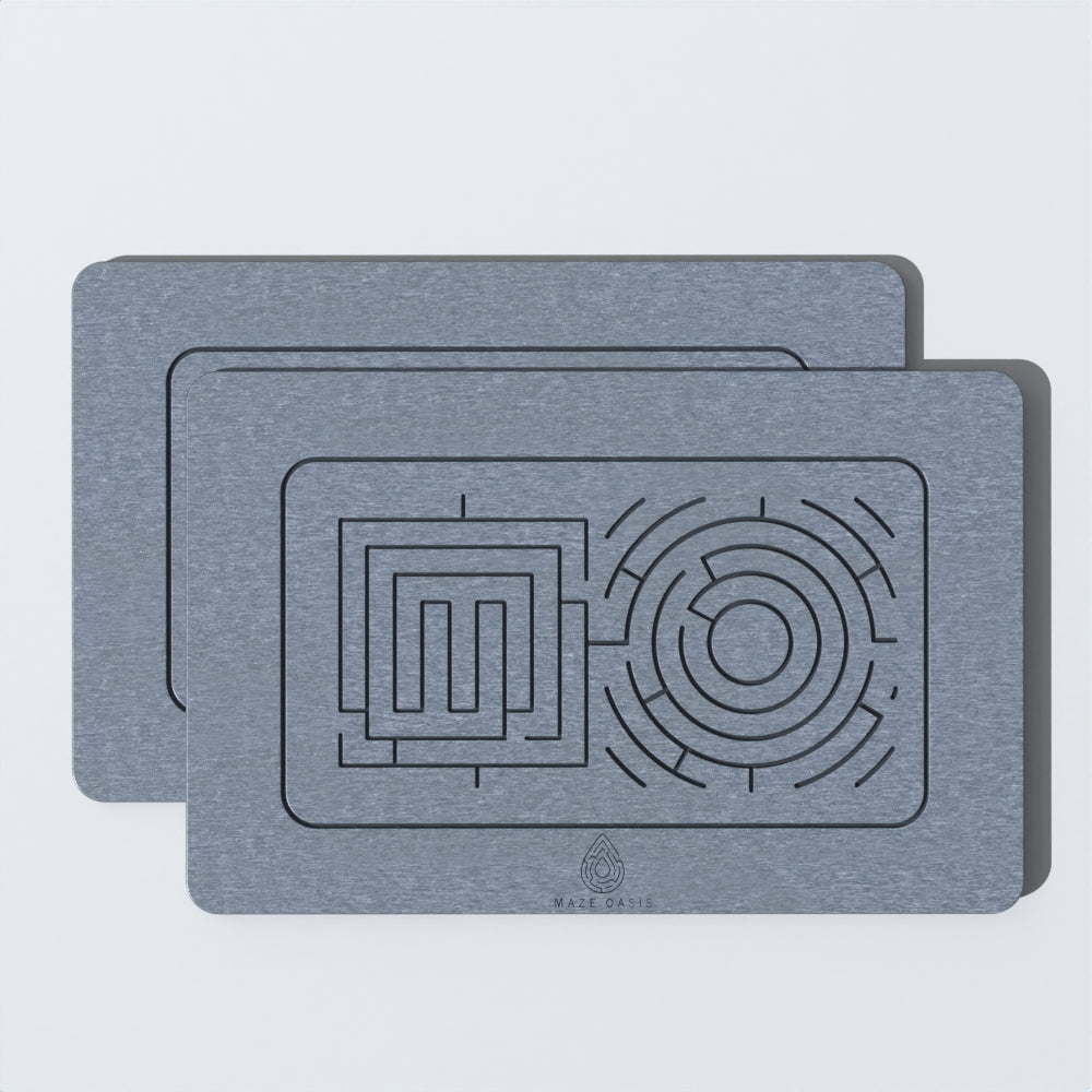 A rectangular stone bath mat with a maze pattern, displayed against a neutral background. 2 Pack Zerenity Ash